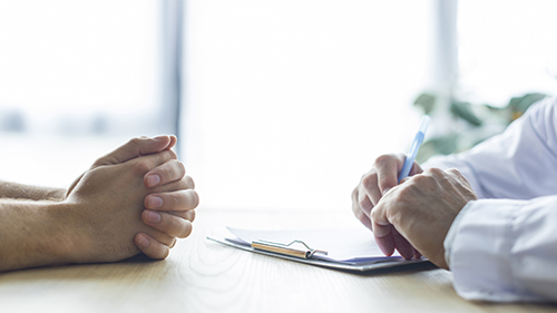 Cropped hands complaint doctor desk feedback report